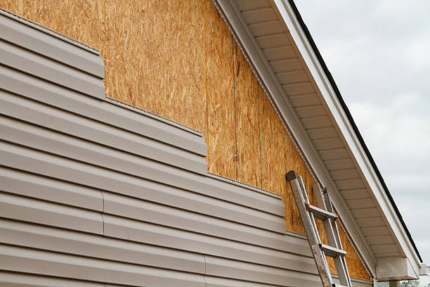 Professional Siding Installation technician working in Chester, WV